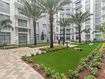 Garden courtyard with water feature, fire pit and hammocks